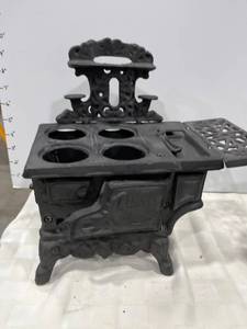 lot 1093 image: Crescent miniature cast iron stove