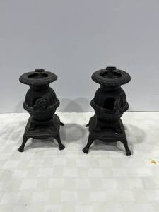 lot 1095 image: Set of two cast iron miniature stoves
