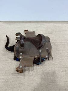 lot 1172 image: A mini saddle