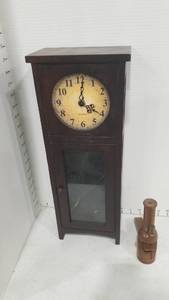 lot 2078 image: Doll clock and nutcracker