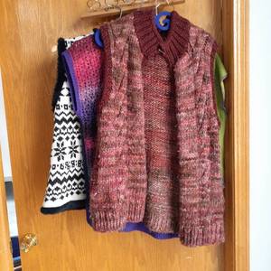 lot 3007 image: Ladies hand knitted sweater vest. One is actually a Talbot(lg), sizes medium and large