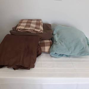 lot 3036 image: King size bedding. Brown has a bed skirt and (1) pillowcase. Green is just a fitted and a flat sheet