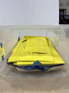 lot 1304 image: A trashcan with lid filled with large stencils