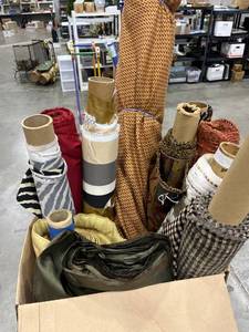 lot 1338 image: A large box of fabric rolls