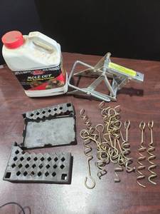 lot 4043 image: Mole trap and repellant, 8 spiral stakes, broken cast iron gizmo