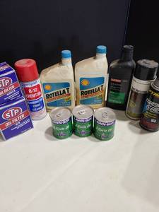 lot 4083 image: Lawn mower oil, engine oil, oil filters, more