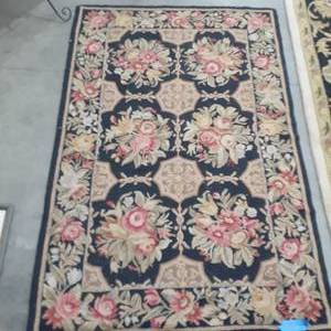 lot 1058 image: Smaller area rug. 64 x 42