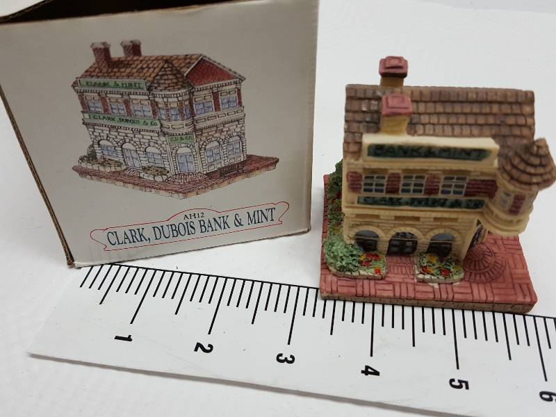 lot 8462 image: Ceramic table top piece sold by Dillards in the 90s as a collectable depicting shops from Liberty Falls