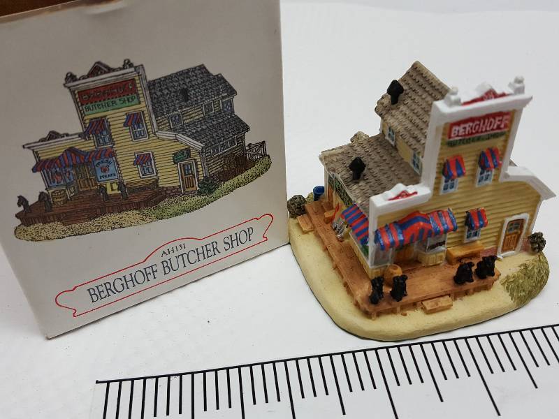 lot 8463 image: Ceramic table top piece sold by Dillards in the 90s as a collectable depicting shops from Liberty Falls