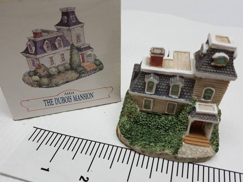 lot 8465 image: Ceramic table top piece sold by Dillards in the 90s as a collectable depicting shops from Liberty Falls