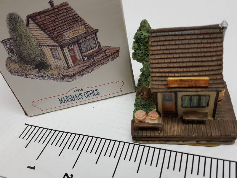 lot 8470 image: Ceramic table top piece sold by Dillards in the 90s as a collectable depicting shops from Liberty Falls
