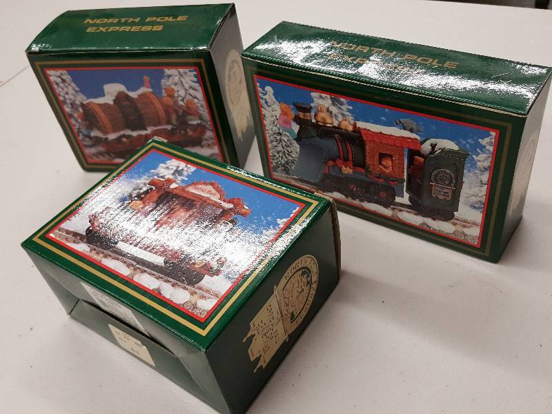 lot 8371 image: Three metal North Pole Express Train and picture frame Christmas Decor