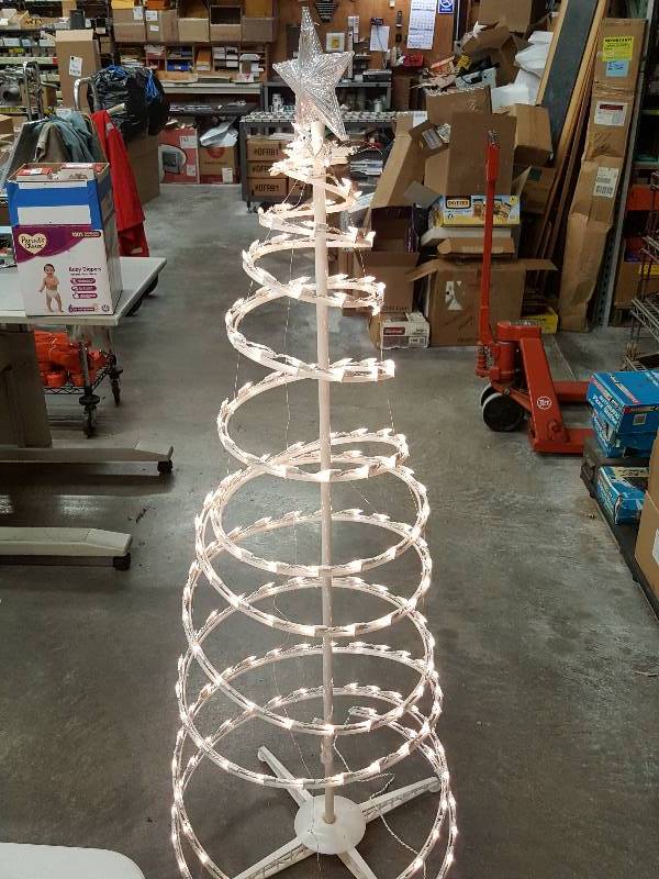 lot 8378 image: 60 Tall  Lighted Spiral Christmas Tree. Can be staked down or just use the tree stand