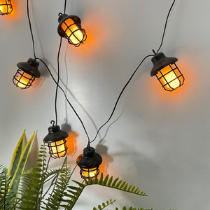 lot 30140 image: Mainstays 10-Count Plastic Solar Powered Flame Effect Lantern Outdoor String Lights