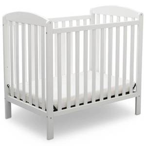 lot 69116 image: Delta Children Emery Mini Convertible Baby Crib with Mattress - Bianca White