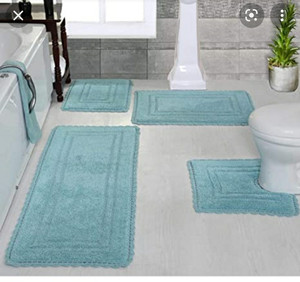 lot 9 image: Casual Elegence 4 Piece Turquoise Bath Mat Set RETAILS FOR $115.00