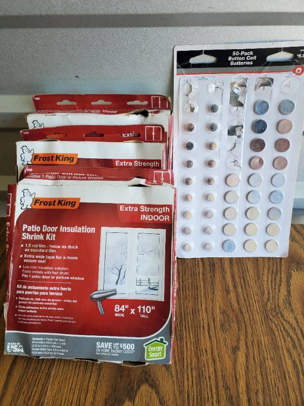 lot 1010 image: Lot of Patio Door Insulation Kits and Button Cell Batteries