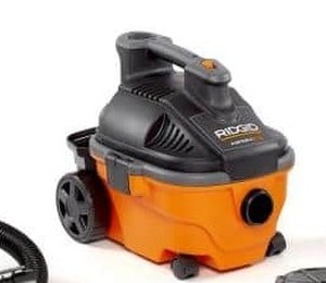 lot 5690 image: RIDGID 15L (4 Gal.) 5.0 Peak HP Portable WetDry Shop Vacuum with Large Rear Wheels & Storage