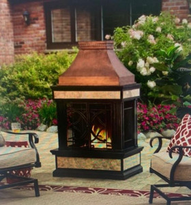 lot 8076 image: Sunjoy Cole Wood Burning Fireplace Bronze retail $677. Sunjoy