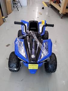 lot 45232 image: Kids battery operated 4 wheeler