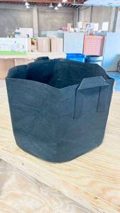 lot 31139 image: Heavy Black Fabric Foldable Storage Bags for Laundry, Toys, Anything. Has Handles. 15 Tall and about 17 Wide. Lot of 10