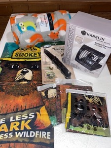 lot 1312 image: Kyocera Pocket Knife, Hanslin Portable Fan, 4 Smokey Bear bandannas