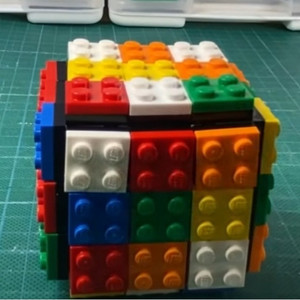 lot 51169 image: Magic Cube Rubix Cube 3x3 Build-on Brick Magic Cube Brain Teaser Puzzle and Bricks Toy in 1 for Kids Adult Gift Compatible with Lego, Black