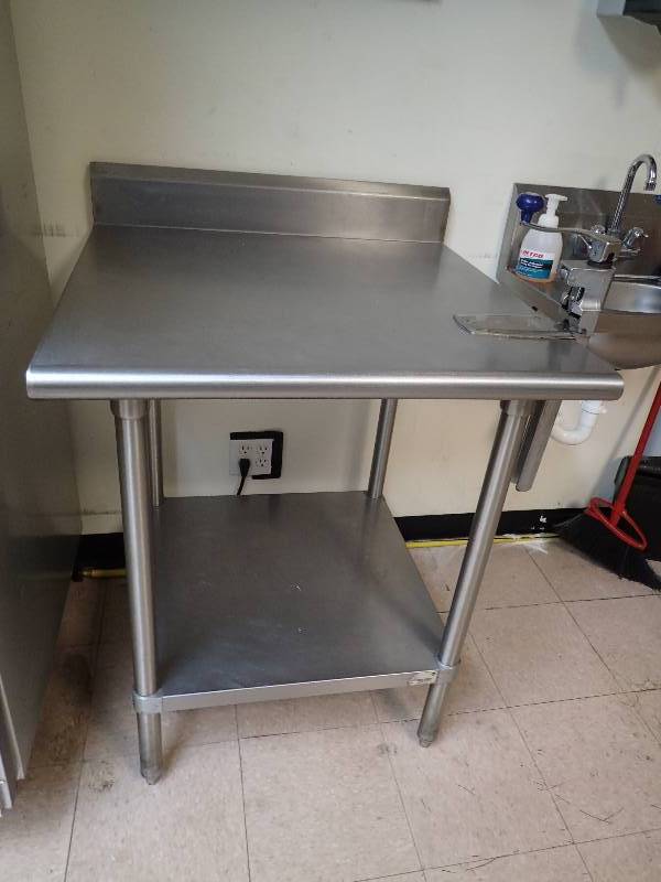 lot 1825 image: Stainless Top Work Table With Stainless Undershelf Includes Edlund Commercial Can Opener