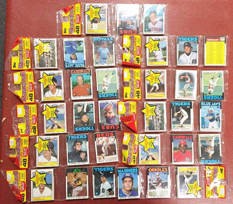 lot 1031 image: (11) 1986 Rack Pack Lot - Factory Sealed After 30 Years - EXTREMELY RARE (3) GEORGE BRETT FRONT WINDOW - CAL RIPKEN FRONT WINDOW