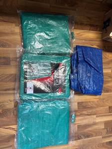 lot 2028 image: 3 8ft. x 10ft. Green Tarps, 1 unknown size Blue Tarp