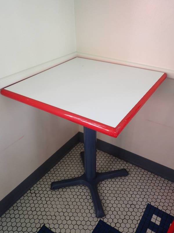 lot 1935 image: White Red Edged Single Metal Based Dining Table
