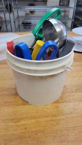 lot 10179 image: Bucket of Assorted Cookie Scoops