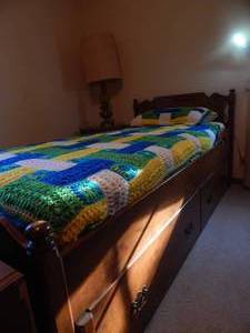 lot 2869 image: Wood Trundle Bed.