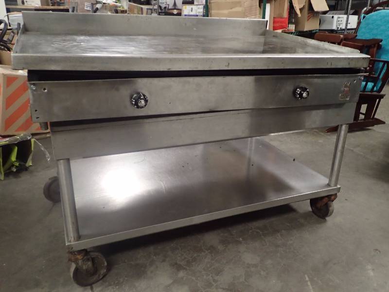 lot 3500 image: Wolf Natural Gas Flat Top Grill with Equipment Stand on Casters