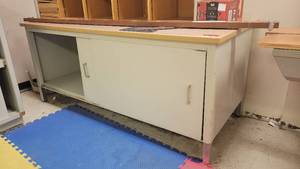 lot 40139 image: Putney Bowes Storage Cabinet W Sliding Doors