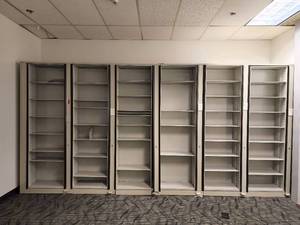 lot 40303 image: Rotating 6 Bay Metal Frame Bookcase