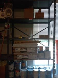 lot 49340 image: Contents of Shelf - Ceiling Tiles, Paint and Light Covers