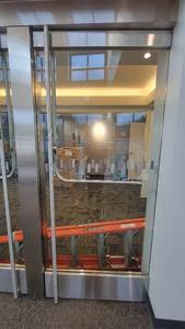 lot 1235 image: Glass Door W Stainless Steel Edges