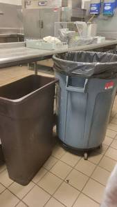 lot 40541 image: Brown Hubert Trash Bin and a Brute Rubbermaid Trash Bin on Wheels