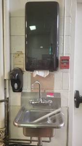 lot 40546 image: Stainless Steel Single Handwashing Sink W a Soap Dispenser and a Tork Towel Dispenser