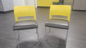 lot 40622 image: Lot of 2 Steelcase Armless Black and Yellow Chairs W a Leather Cushion