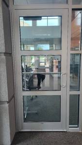 lot 1241 image: Kawneer Metal Door W Glass Windows