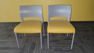 lot 22619 image: Lot of 2 Steelcase Gray Armless Chairs W a Yellow Seat Cushion