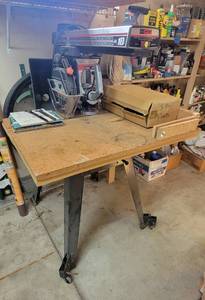 lot 4024 image: Craftsman Radial Saw 10 Inch on Metal Stand with Wheels and 5 Extra Blades - Model 509346