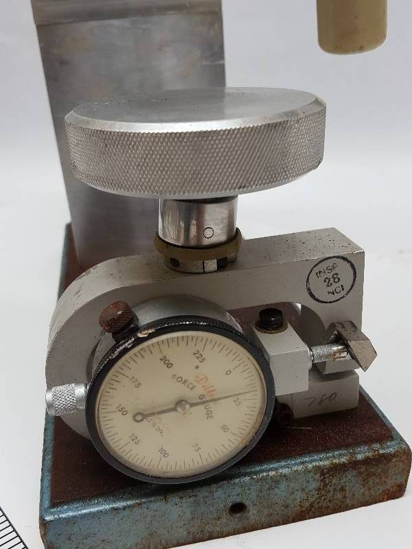 Dillon Mechanical Force Gauge Model X mounted in a heavy cast iron