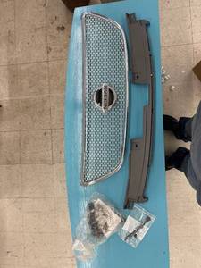lot 12 image: Nissan grill parts