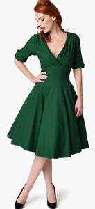 lot 3751 image: Unique Vintage 1950s Emerald Green Delores Swing Dress with Sleeves (size unknown)