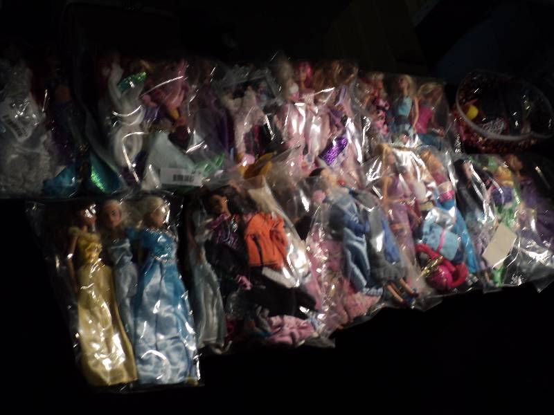 lot 5019 image: Large lot of Barbie Dolls, clothing and accessories-- over 30 pieces