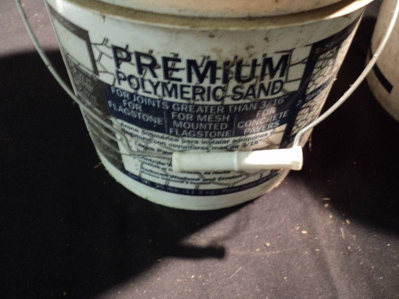 lot 5034 image: 31 lbs of Premium Polmeric Sand in 2 buckets (1- full, 1 partially full)