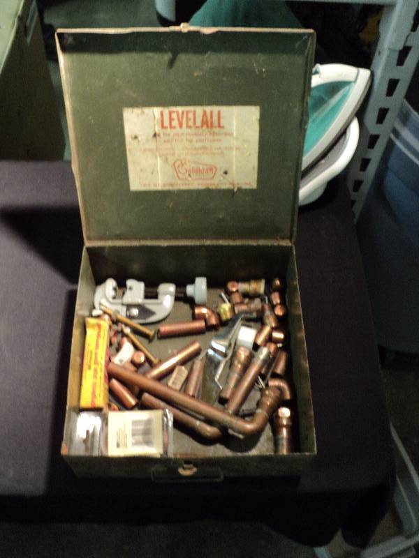 lot 5037 image: Metal box with plumbing repair supplies, pipe cutter, copper pipe fittings